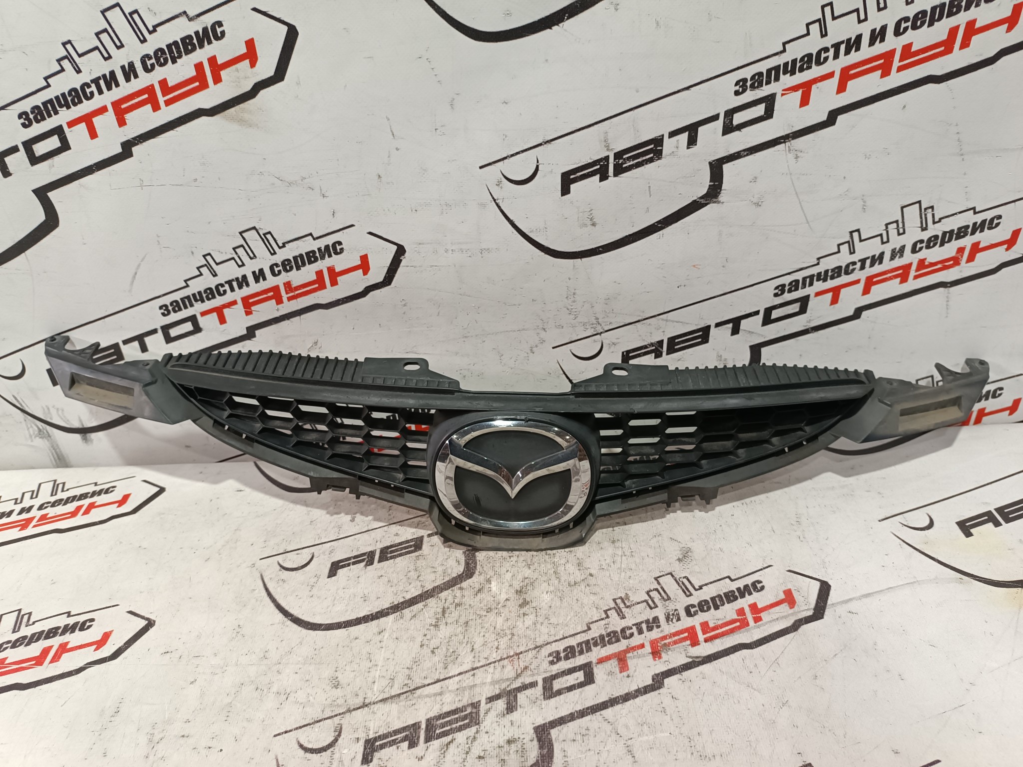 РЕШЕТКА РАДИАТОРА MAZDA D65150710B  NA6085Z