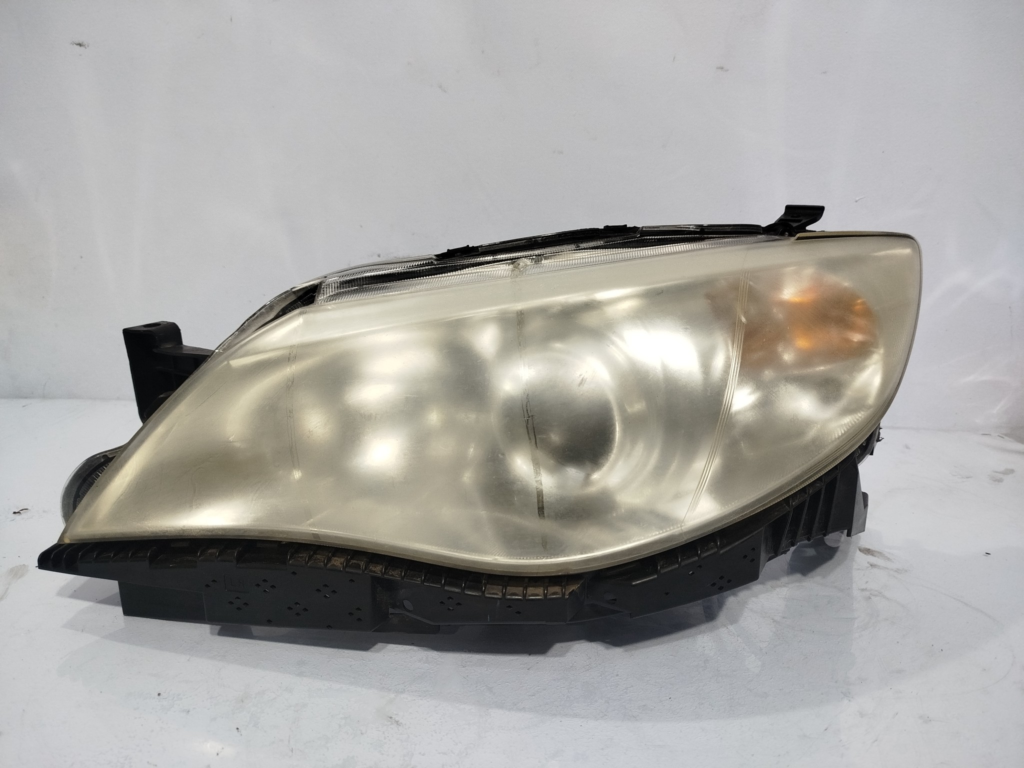 ФАРА SUBARU ЛЕВАЯ 84001FG011 XA7620