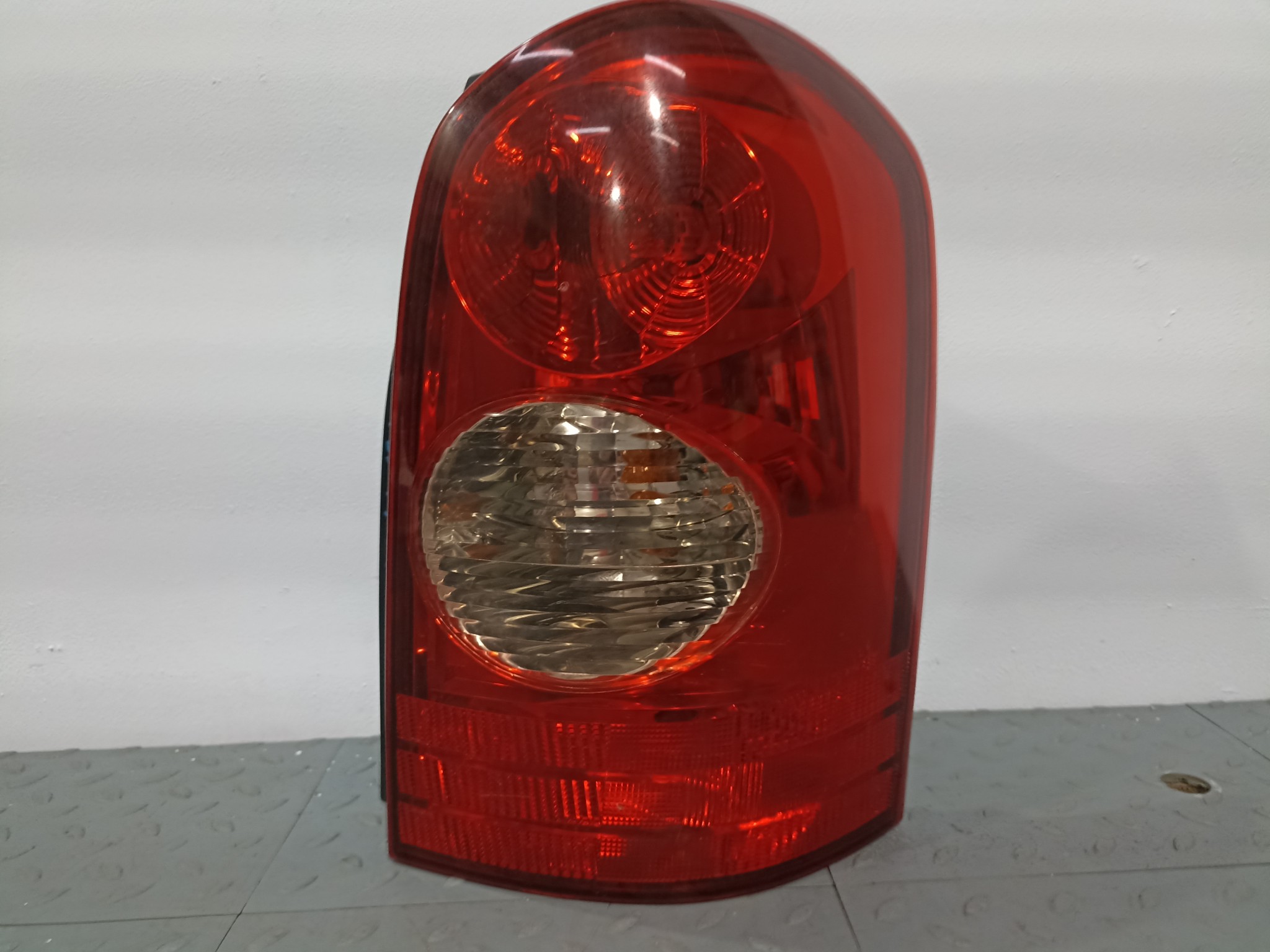 ФОНАРЬ MAZDA ПРАВЫЙ L12051150B  S4021